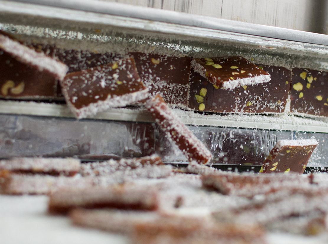 Pistachio cezerye slices dusted with powdered sugar